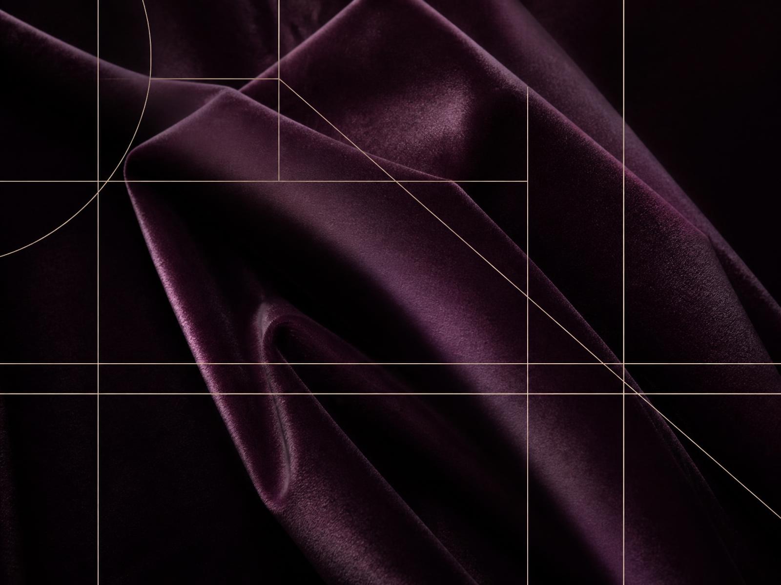 Deep aubergine velvet folds overlaid with a fine ivory grid